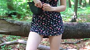 Horny teen inserts butt plug and flashes hairy pussy in public park