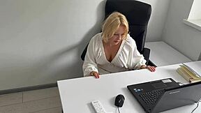 Horny office secretary relaxes by masturbating to porn at her workplace