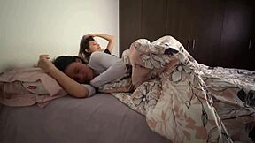 Lesbians snuggle in bed and touch their asses