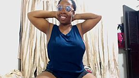 Ebony mom flexes her big tits in muscular display!