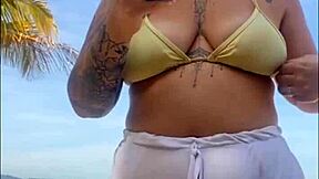 My shorts are marking my big pussy on the beach, flashing exhibitionist style.