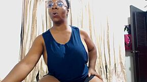 Ebony mom flexes her big tits in muscular display!