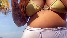 My shorts are marking my big pussy on the beach, flashing exhibitionist style.