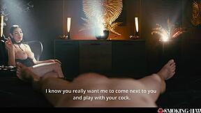 French brunette smokes cigarette and talks while relaxing