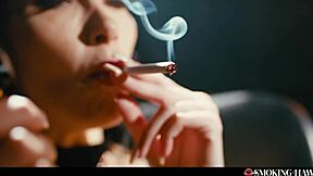 French brunette smokes cigarette and talks while relaxing