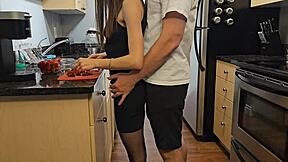 She's the petite step sister in black dress getting fucked in the kitchen