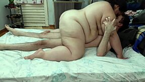 In a cozy home, a couple enjoys an intimate moment together.