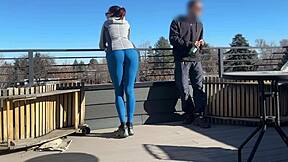 Little redhead slut gives fast handjob and blowjob on the roof.