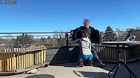 Little redhead slut gives fast handjob and blowjob on the roof.