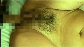 A Woman Writhes In Cowgirl Position