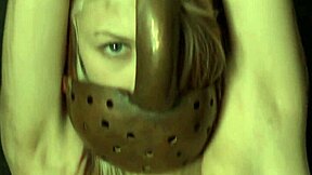 Chained Up Woman Masturbates Her Shaved Pussy