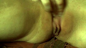 Chained Up Woman Masturbates Her Shaved Pussy