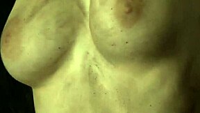 Chained Up Woman Masturbates Her Shaved Pussy