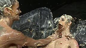 Nasty Lesbians Covered With Food Rub Each Other And Make Out As They Finger Their Cunts