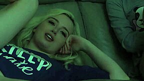 teen shares the couch with stepdad while watching a scary movie