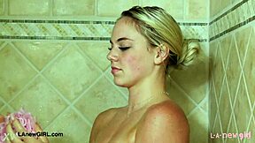 Cute teen blonde takes a relaxing shower