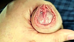 Lots of precum while edging my unique cock in this homemade solo session.