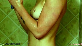 Cute teen blonde takes a relaxing shower