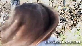 Columbian teen Lupe cutie fingers her smooth pussy outdoors