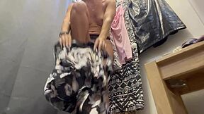 a curvy milf browses outfits trying dresses shorts in secret spy footage