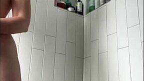 pretty tattooed milf with big clit masturbates wet pussy in shower bath