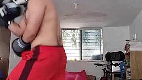 Amateur boxer spars hard in intense workout session