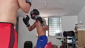 Amateur boxer spars hard in intense workout session