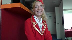 Feeling the Thrill as Air Hostess Monique Woods Poses in Uniform on Bed