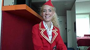 Feeling the Thrill as Air Hostess Monique Woods Poses in Uniform on Bed
