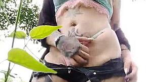 Young Curitiba girl flashes pierced pussy to wild guys in the bush