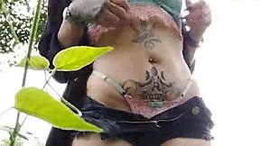 Young Curitiba girl flashes pierced pussy to wild guys in the bush