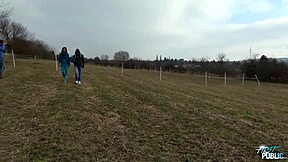 Public threesome bends nasty brunette over big cocks