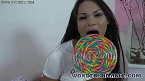 bubble butt latina transsexual strips teasingly then strokes her throbbing cock