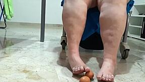 Coolmarina's tired feet massaged with hard-boiled eggs on the floor