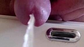 close-up fetish slut pisses wildly in the sink dripping everywhere
