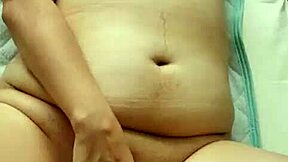 wanna spy this fat japanese milf masturbate her bald pussy?