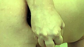 Stuffing water bottle deep into ass alongside massive dildos