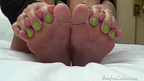 leilani lei's teasing you with her sexy feet and those bright green toes in bed