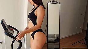 hot brunette spreads wet pussy in bikini teasing barefoot on treadmill close up