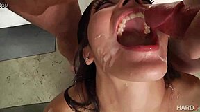 her mouth overflowing with six thick loads from gangbang bukkake orgy