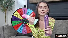 anal slut spins wheel to stretch her hole