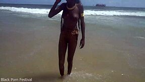 Skinny tribe slut bares tits on beach begging for it?