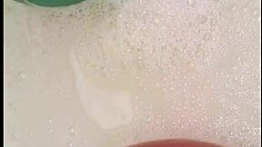 yo, check this tattooed babe teasing her trimmed pussy with bath balloons