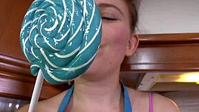 brunette teases lollipop lips in sexy high heels