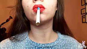 curvy brunette with big natural tits smokes cigarette in close-up pov fetish