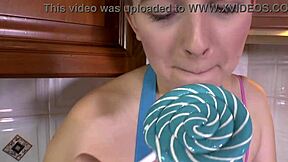 brunette teases lollipop lips in sexy high heels