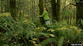 bound and handcuffed to forest tree she squirms desperate for pee release in nature accident