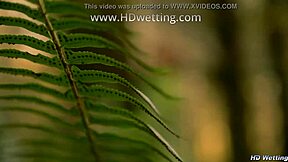 bound and handcuffed to forest tree she squirms desperate for pee release in nature accident