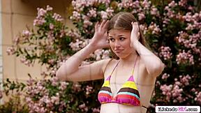 Petite lesbian fingers brunette friend's shaved pussy outdoors