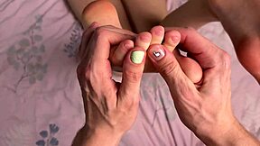 Gorgeous babe's bare feet stroke cock in homemade POV footjob close-up